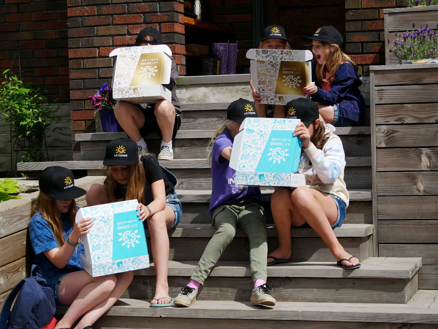children opening artshine in a box subscriptions