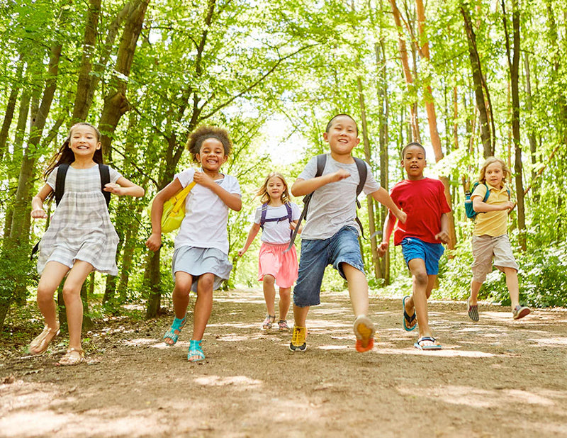 kids running in forest